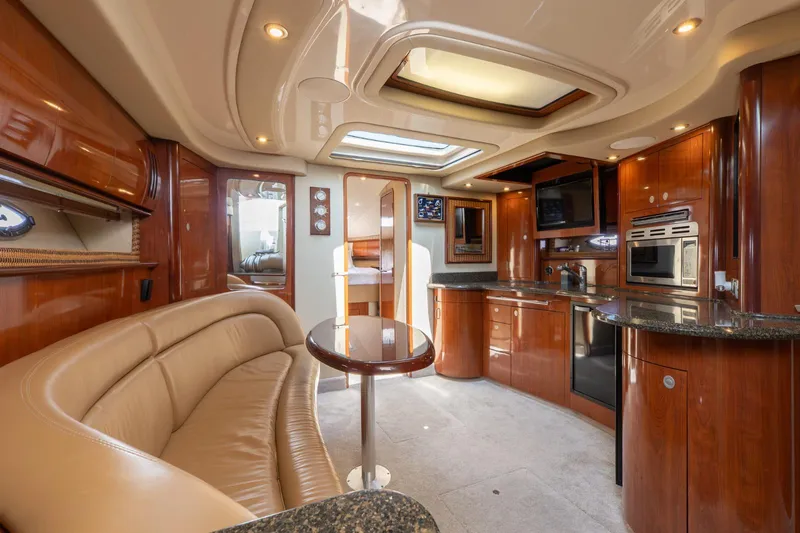  Yacht Photos Pics Luxurious interior of 2005 Sea Ray 420 Sundancer yacht with elegant wood finishes.