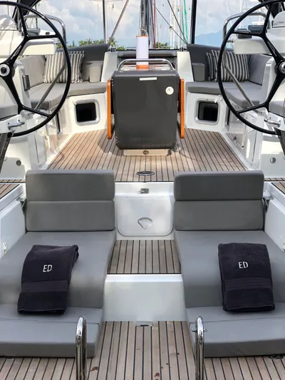 Edwina Yacht Photos Pics Luxury Jeanneau 54 yacht deck, 2018 model, featuring dual steering wheels and elegant seating.