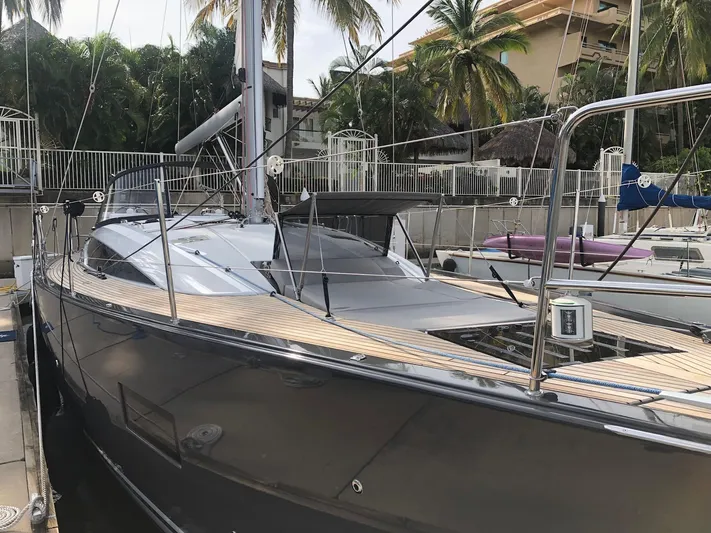 Edwina Yacht Photos Pics 2018 Jeanneau 54 sailboat docked, featuring sleek design and modern amenities.