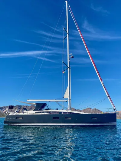 Edwina Yacht Photos Pics 2018 Jeanneau 54 sailboat on calm water under clear blue sky.
