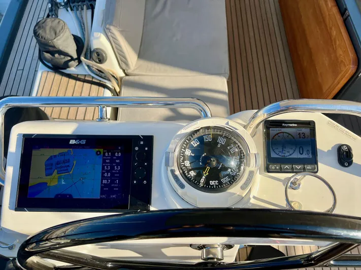 Edwina Yacht Photos Pics Cockpit of 2018 Jeanneau 54 sailboat with navigation instruments and steering wheel.