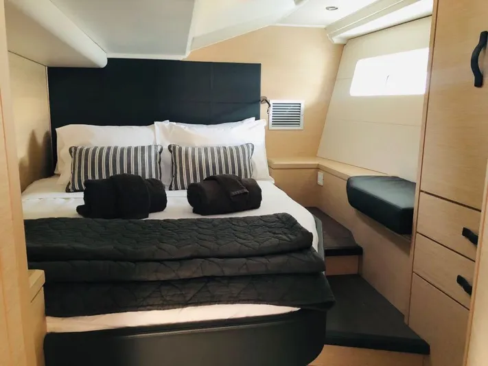 Edwina Yacht Photos Pics Luxurious cabin interior of 2018 Jeanneau 54 yacht with cozy bedding and modern design.