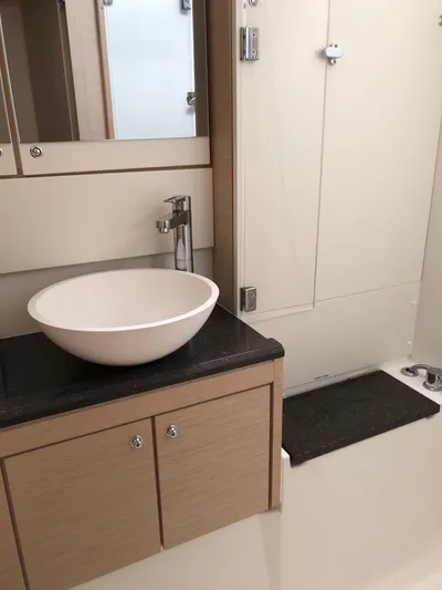 Edwina Yacht Photos Pics Modern bathroom in 2018 Jeanneau 54 yacht with sleek sink and cabinetry.
