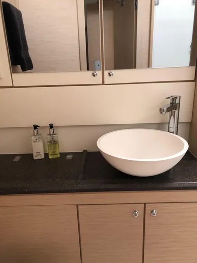 Edwina Yacht Photos Pics Modern bathroom in 2018 Jeanneau 54 yacht with vessel sink and toiletries.