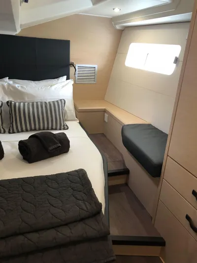 Edwina Yacht Photos Pics Luxurious cabin interior of 2018 Jeanneau 54 yacht with modern bedding and natural light.