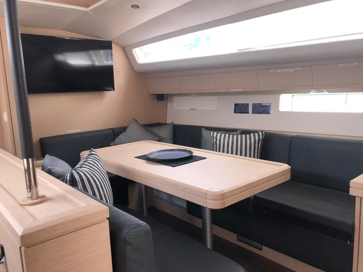 Edwina Yacht Photos Pics Interior of 2018 Jeanneau 54 yacht with modern seating and dining area.