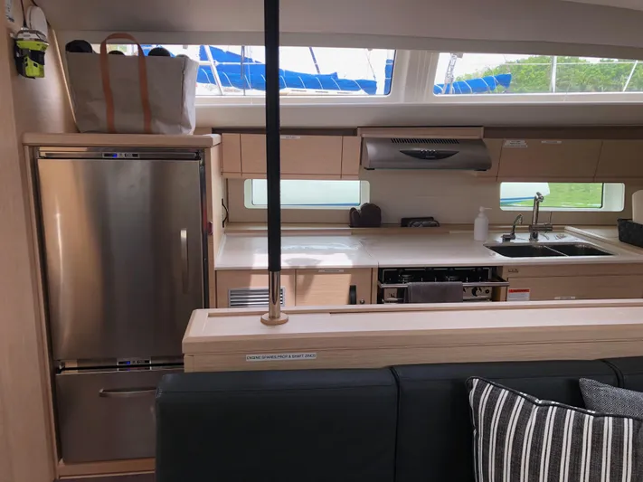 Edwina Yacht Photos Pics Interior of 2018 Jeanneau 54 yacht kitchen with modern appliances and sleek design.