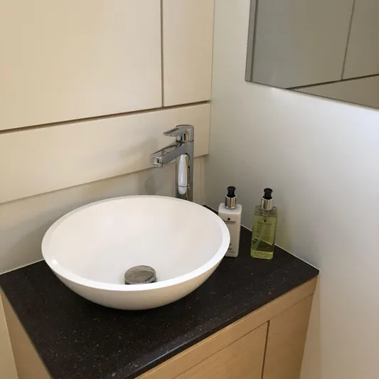 Edwina Yacht Photos Pics Modern bathroom sink on Jeanneau 54 yacht, 2018 model, with soap dispensers.