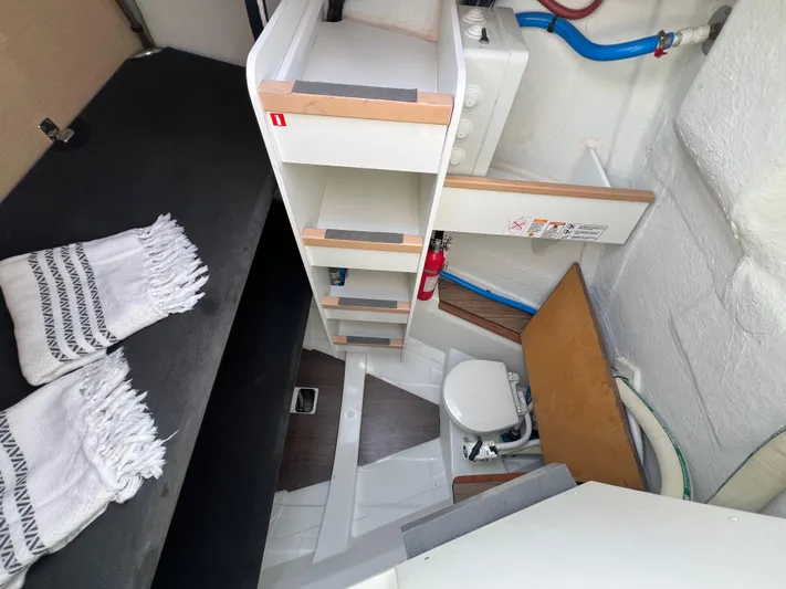 Edwina Yacht Photos Pics 2018 Jeanneau 54 yacht interior with compact bathroom and storage shelves.