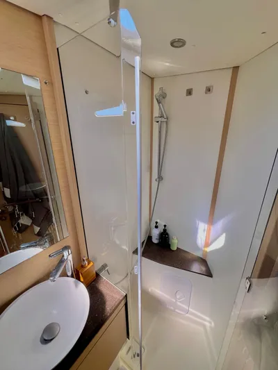 Edwina Yacht Photos Pics 2018 Jeanneau 54 yacht bathroom with modern fixtures, shower, and sink.