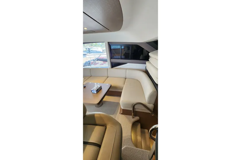  Yacht Photos Pics Luxurious interior of 2022 Princess F50 yacht with elegant seating and table.