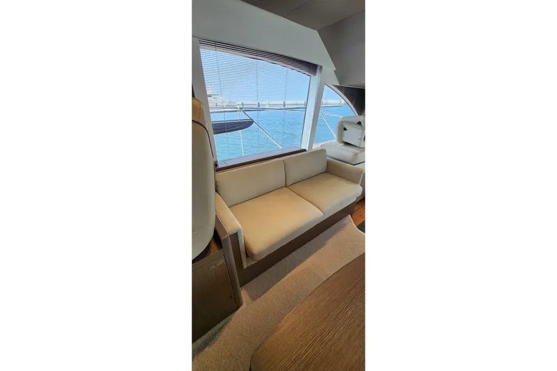  Yacht Photos Pics Luxurious interior of 2022 Princess F50 yacht with beige seating and ocean view.