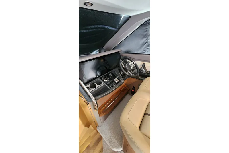  Yacht Photos Pics 2022 Princess F50 yacht helm with modern controls and luxurious interior design.
