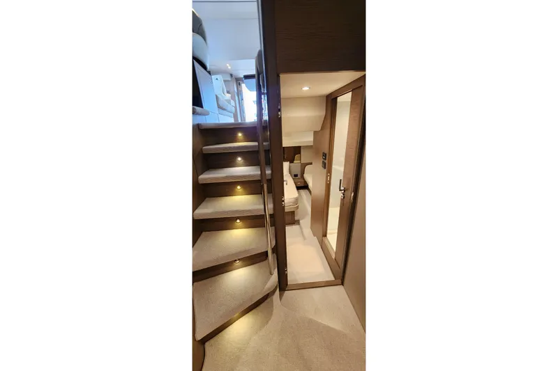  Yacht Photos Pics Interior of 2022 Princess F50 yacht with illuminated stairs and modern design.