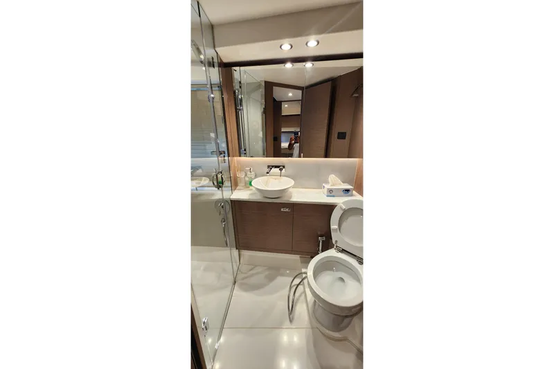  Yacht Photos Pics Luxurious bathroom in 2022 Princess F50 yacht with modern fixtures and elegant design.