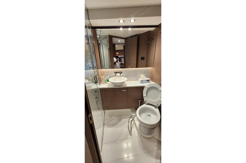  Yacht Photos Pics Modern bathroom interior on 2022 Princess F50 yacht, featuring sleek design and elegant fixtures.