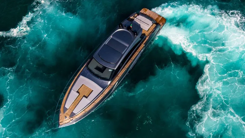  Yacht Photos Pics Aerial view of 2024 Rizzardi IN SIX yacht cruising through turquoise waters.