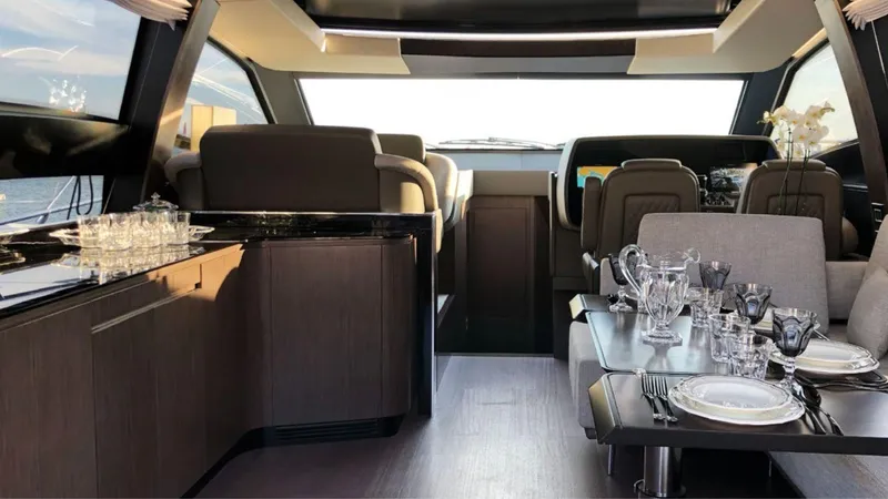  Yacht Photos Pics Luxurious interior of the 2024 Rizzardi IN SIX yacht with elegant dining setup.
