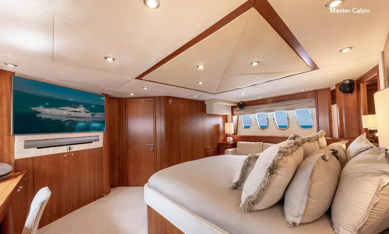  Yacht Photos Pics Luxurious master cabin in 2007 Sunseeker 90 Yacht with elegant wood finishes.
