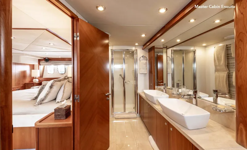  Yacht Photos Pics Luxurious master cabin ensuite on 2007 Sunseeker 90 Yacht, featuring elegant wood finishes.
