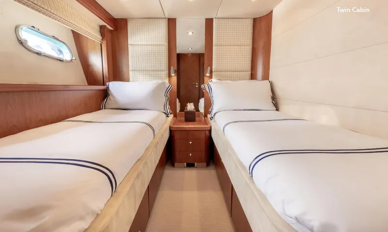  Yacht Photos Pics Twin cabin in 2007 Sunseeker 90 Yacht, featuring two beds and elegant wood finishes.