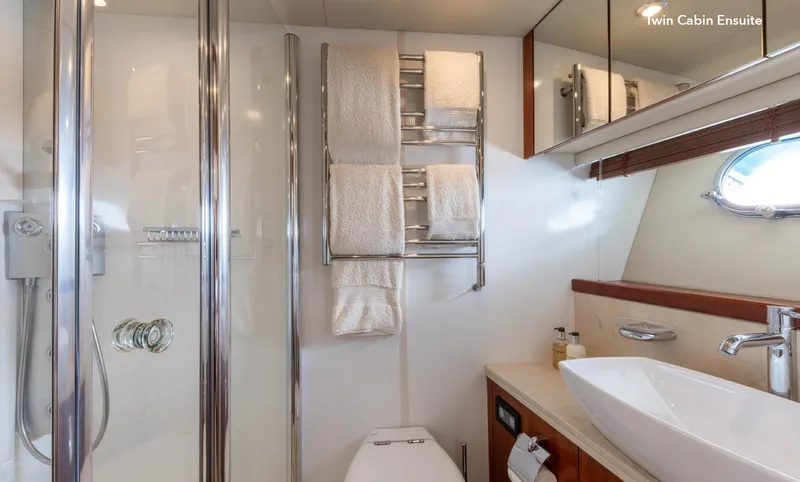  Yacht Photos Pics Luxurious bathroom in a 2007 Sunseeker 90 Yacht, featuring modern fixtures and elegant design.