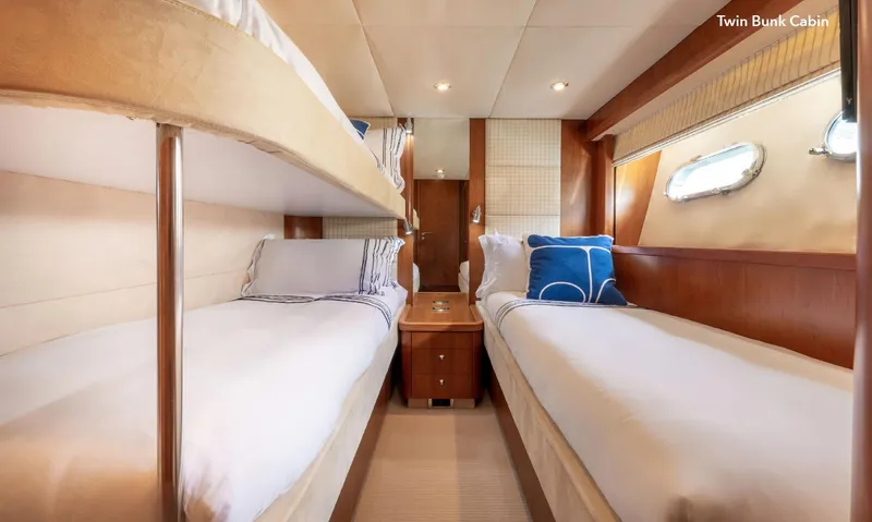  Yacht Photos Pics Twin bunk cabin in 2007 Sunseeker 90 Yacht, featuring cozy beds and elegant wood finishes.