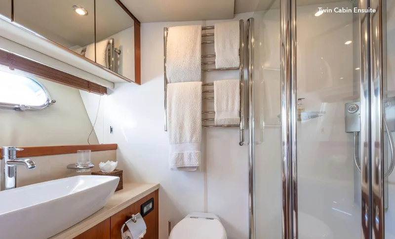  Yacht Photos Pics Luxurious bathroom in 2007 Sunseeker 90 Yacht with modern fixtures and elegant design.