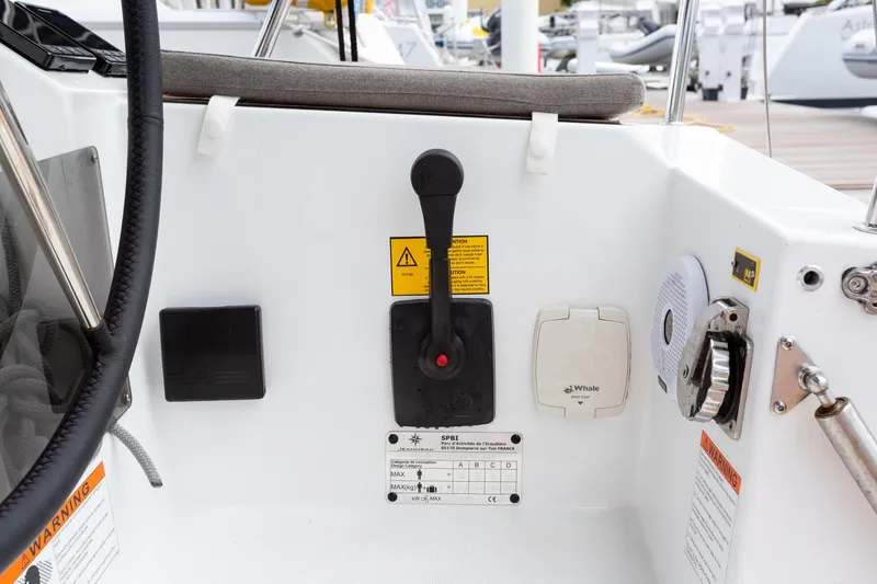 Off The Clock Yacht Photos Pics Control panel of 2020 Jeanneau Sun Odyssey 349 sailboat, featuring throttle and instrument panel.