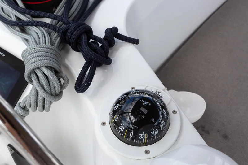 Off The Clock Yacht Photos Pics Compass and ropes on Jeanneau Sun Odyssey 349 sailboat, 2020 model.
