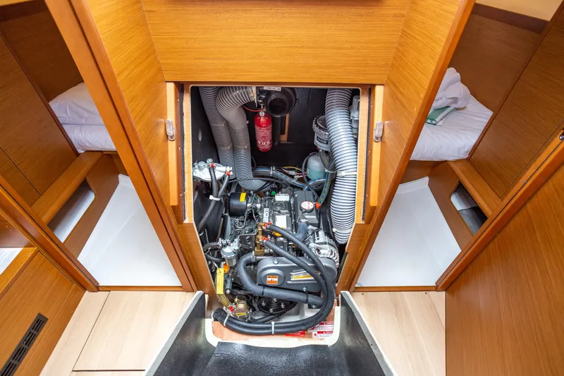 Off The Clock Yacht Photos Pics Engine compartment of 2020 Jeanneau Sun Odyssey 349 sailboat, showcasing detailed interior design.