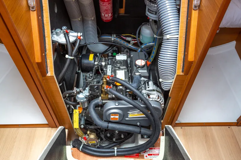 Off The Clock Yacht Photos Pics Engine compartment of 2020 Jeanneau Sun Odyssey 349 sailboat, showcasing detailed mechanical components.