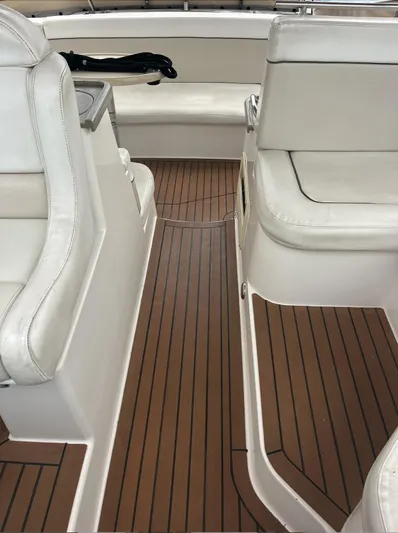  Yacht Photos Pics 2006 Rinker 390 Express Cruiser interior with white seating and wooden flooring.