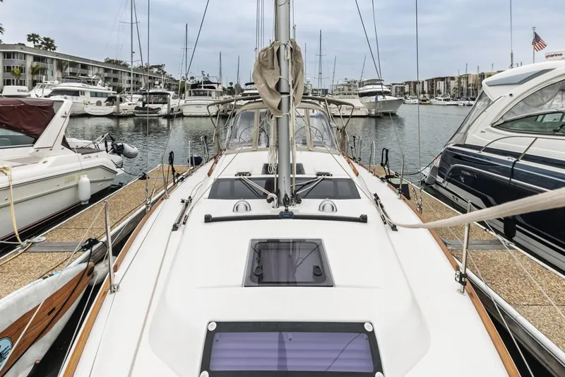 Dotwick Jinga Yacht Photos Pics Dufour 360 sailboat docked in a marina, surrounded by other boats, 2020 model.