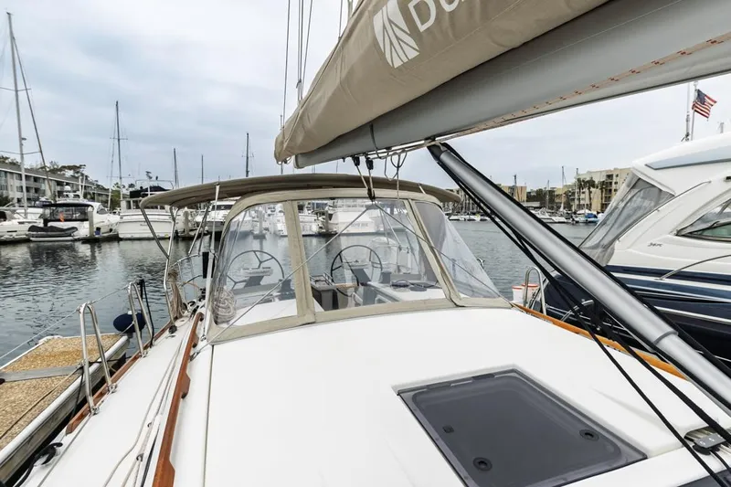 Dotwick Jinga Yacht Photos Pics 2020 Dufour 360 sailboat docked in marina, showcasing cockpit and sail details.