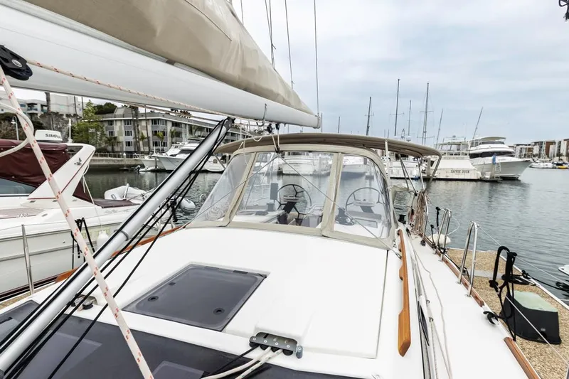 Dotwick Jinga Yacht Photos Pics 2020 Dufour 360 sailboat docked in marina, showcasing deck and cockpit area.