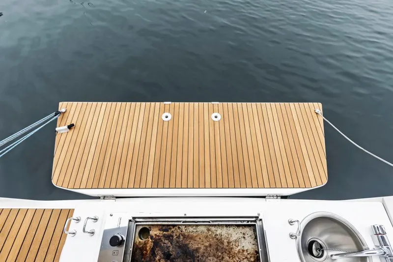 Dotwick Jinga Yacht Photos Pics Dufour 360 yacht stern with wooden deck and built-in sink, 2020 model.