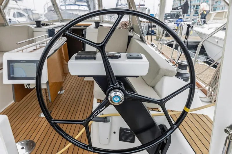 Dotwick Jinga Yacht Photos Pics Steering wheel of a 2020 Dufour 360 yacht with modern navigation equipment.