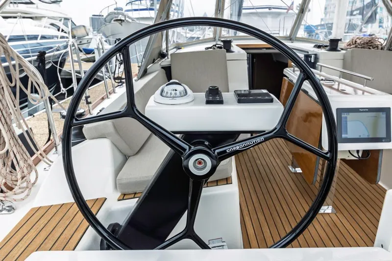Dotwick Jinga Yacht Photos Pics Steering wheel of a 2020 Dufour 360 sailboat with navigation instruments.