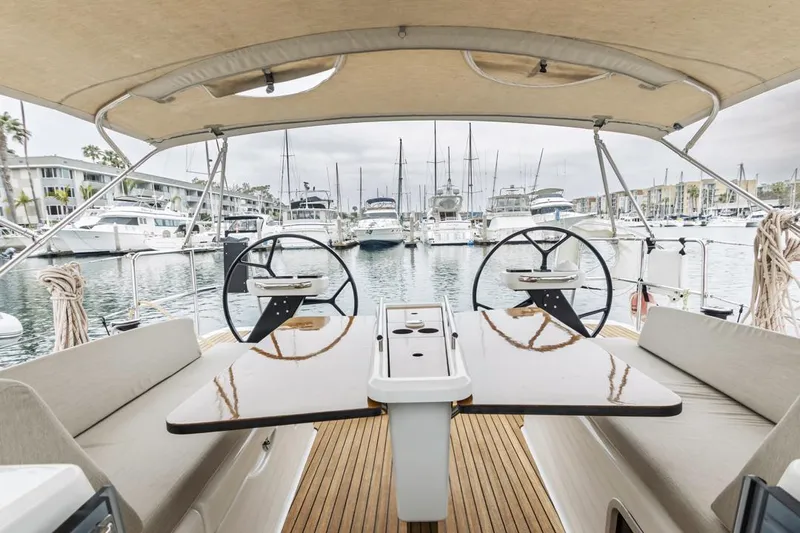 Dotwick Jinga Yacht Photos Pics Dufour 360 sailboat cockpit with dual steering wheels, docked in a marina, 2020 model.