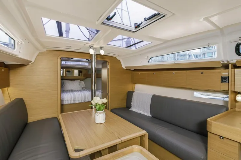 Dotwick Jinga Yacht Photos Pics Interior of 2020 Dufour 360 yacht with modern seating and skylights.