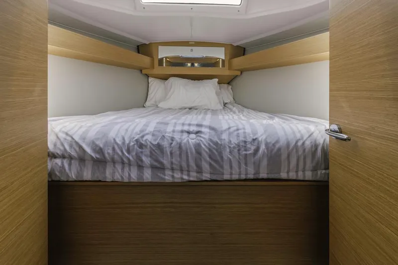 Dotwick Jinga Yacht Photos Pics Cozy cabin interior of 2020 Dufour 360 yacht with comfortable bedding.