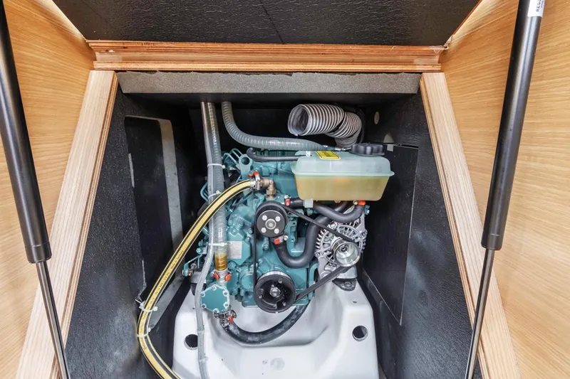 Dotwick Jinga Yacht Photos Pics Engine compartment of a 2020 Dufour 360 sailboat, showcasing mechanical components.