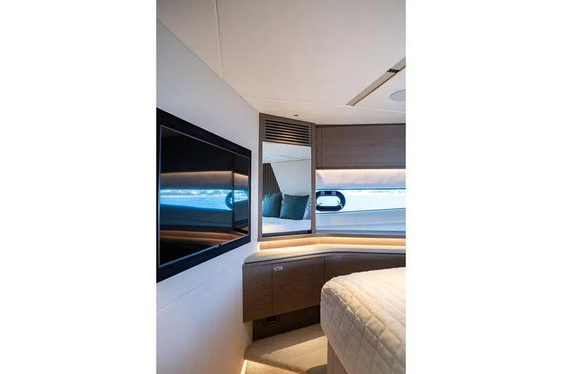  Yacht Photos Pics Luxurious interior of 2023 Princess Y72 yacht with modern TV and elegant furnishings.