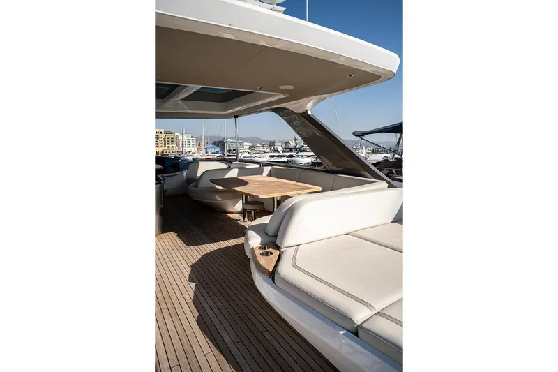  Yacht Photos Pics Luxurious 2021 Princess Y72 yacht deck with seating and table, docked at marina.