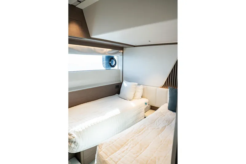  Yacht Photos Pics Luxurious cabin interior of 2023 Princess Y72 yacht with twin beds and modern design.