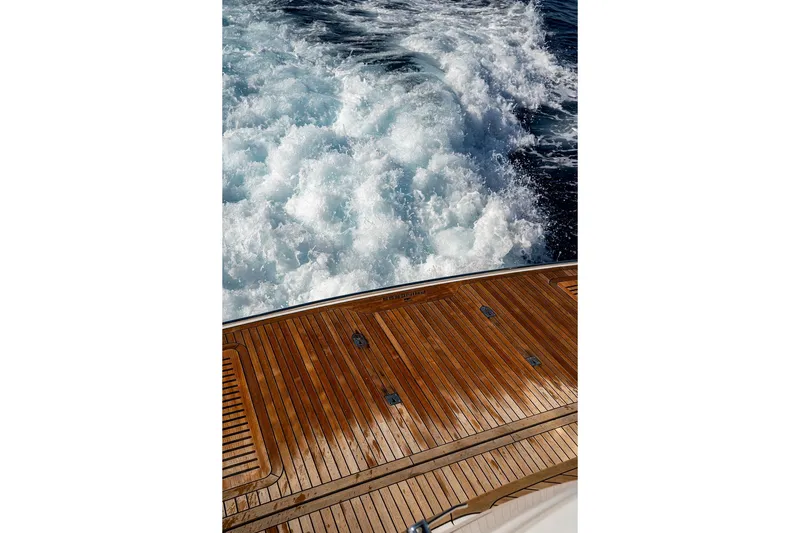  Yacht Photos Pics Teak deck of 2023 Princess Y72 yacht with ocean waves behind.