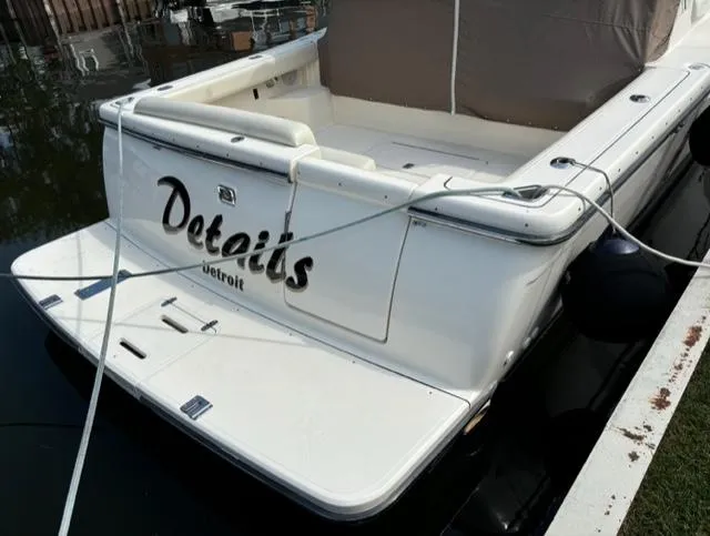 Details Yacht Photos Pics 1998 Tiara Yachts 35 Open boat docked, rear view with "Details" name visible.