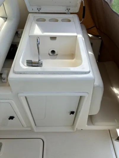 Details Yacht Photos Pics 1998 Tiara Yachts 35 Open boat sink and storage area.