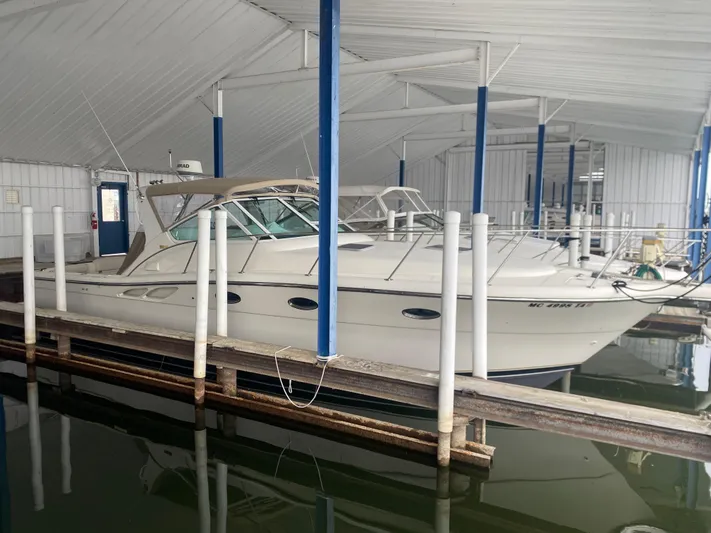 Details Yacht Photos Pics 1998 Tiara Yachts 35 Open docked in a covered marina.